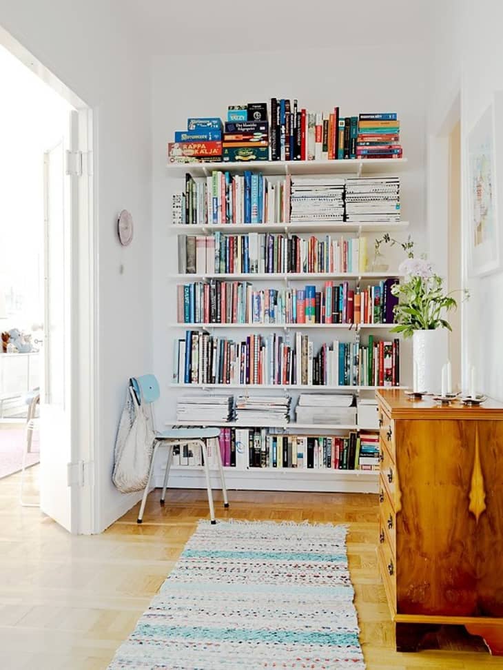Bookshelf against wall for sound absorption